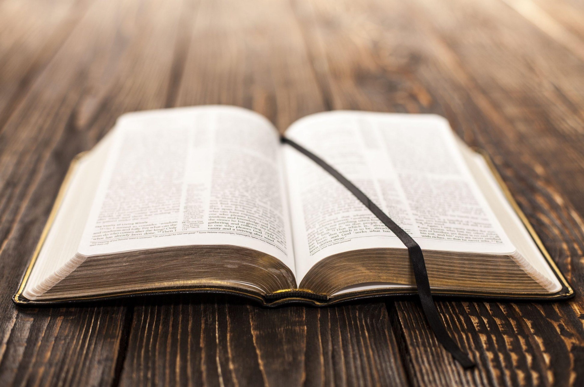 Open Bible on a wooden table
